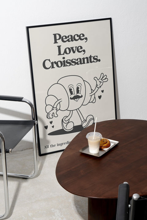 Peace, Love & Croissants poster från FrenzyFrame visad med ram som tillval i inredning